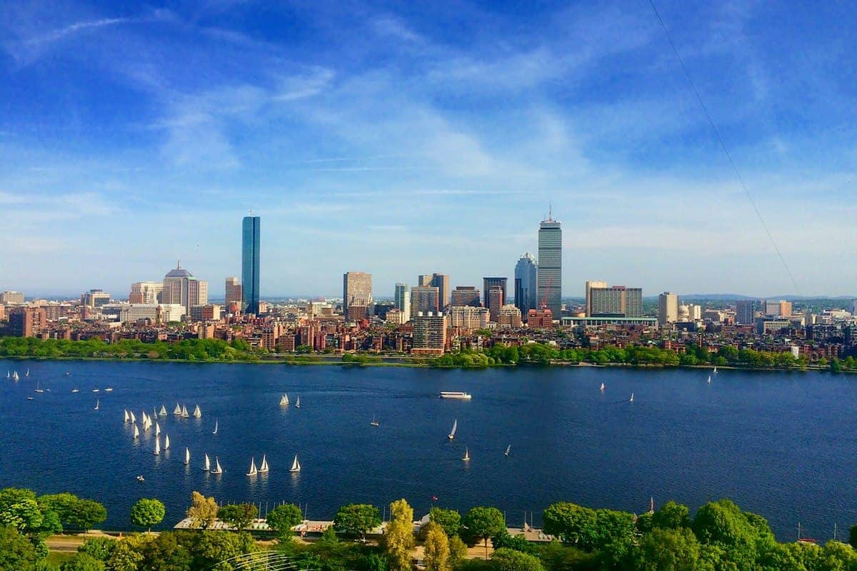 Boston skyline across the Charles River with sailboats