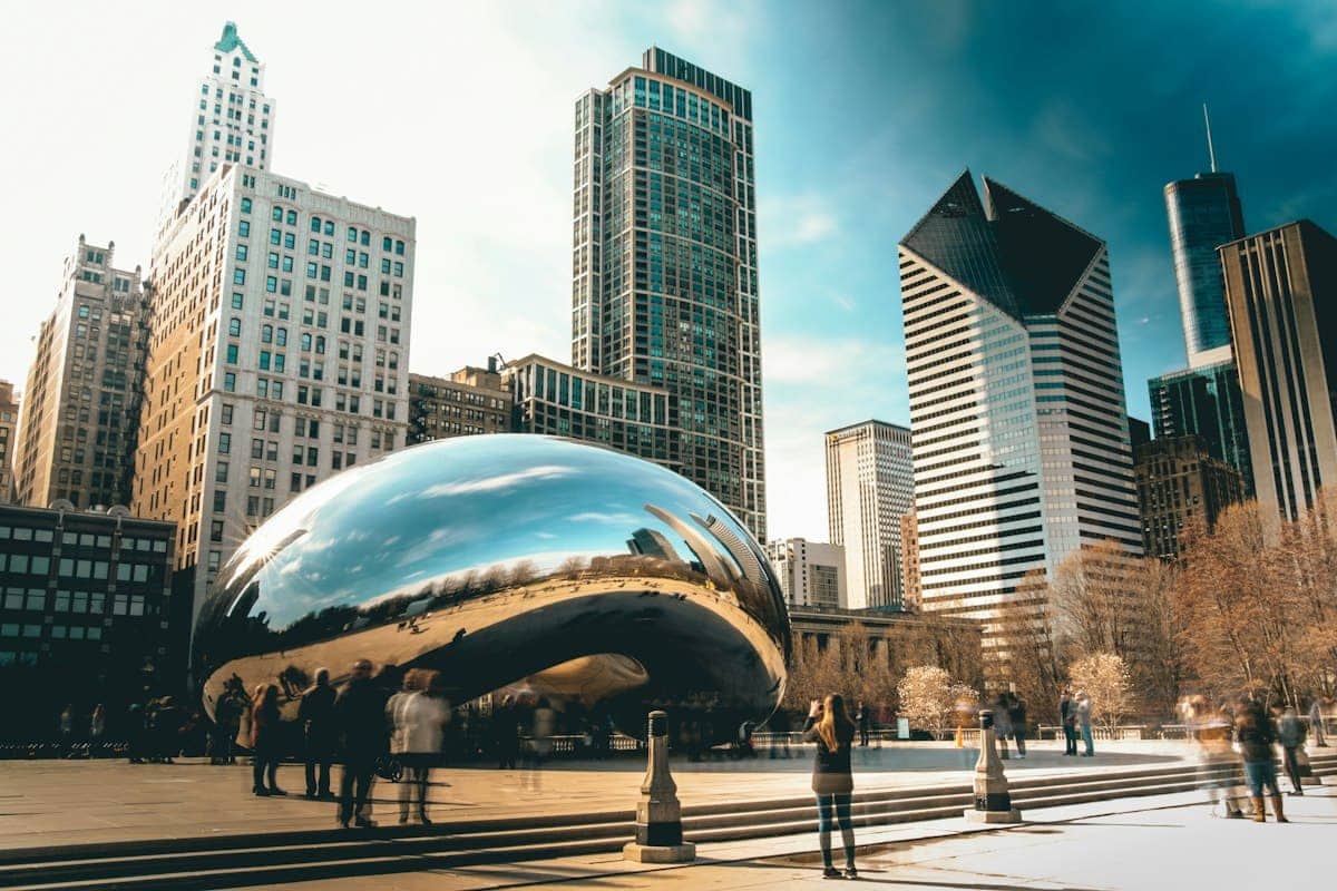 Cloud Gate sculpture in Millennium Park with Chicago towers behind