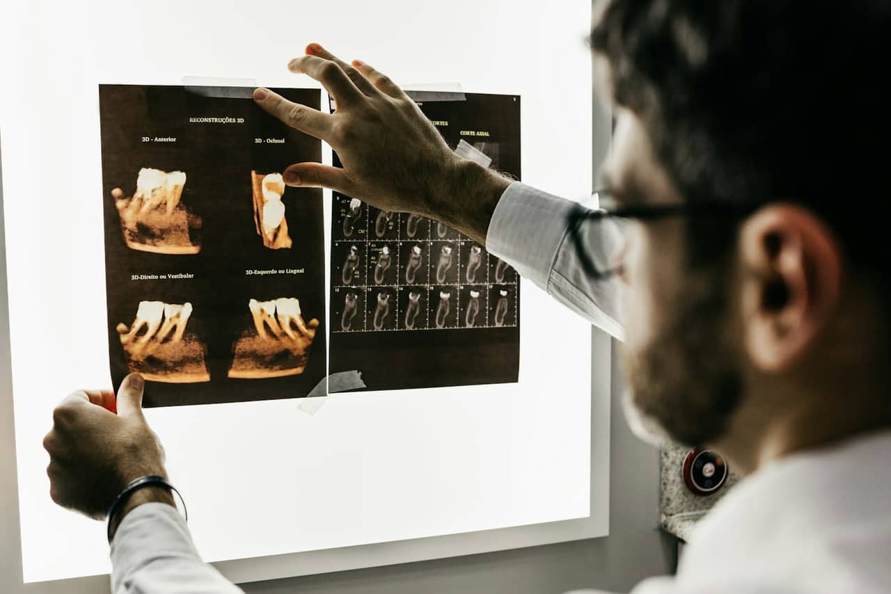 A dentist reviewing an x-ray